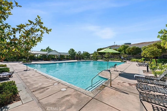 22517 Skipping Stone Dr, Saugus, CA 91350 - community pool featuring a patio area