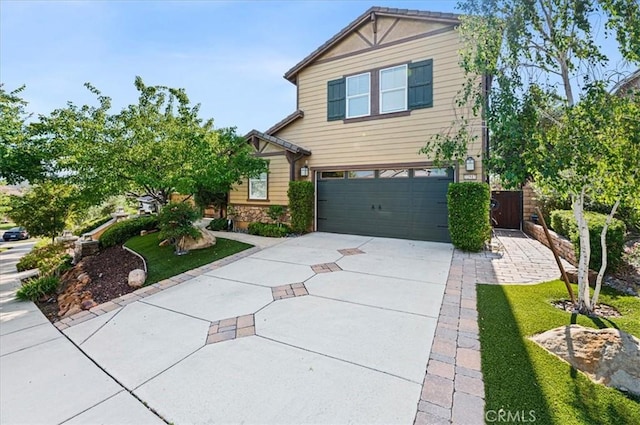 22517 Skipping Stone Dr, Saugus, CA 91350 - view of front of property with a garage, driveway, and stone siding