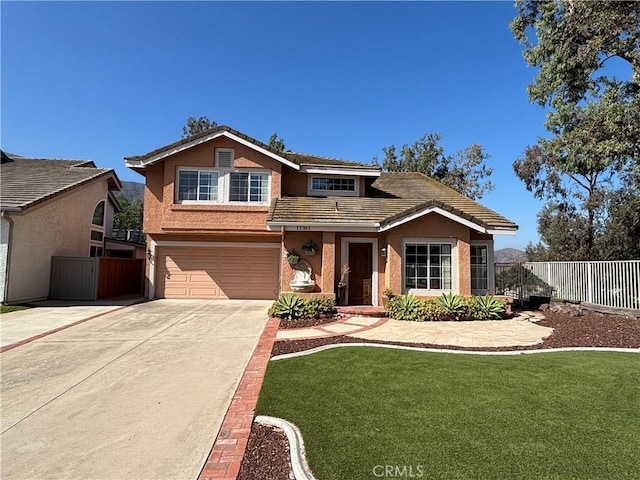 11361 Foxglove Ln, Corona, CA 92878 - traditional home featuring an attached garage, stucco siding, driveway, and a tile roof