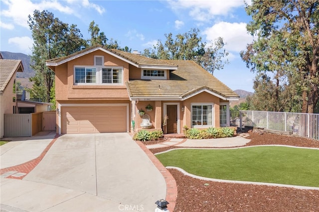 11361 Foxglove Ln, Corona, CA 92878 - traditional-style house featuring a tiled roof, stucco siding, an attached garage, driveway, and a mountain view