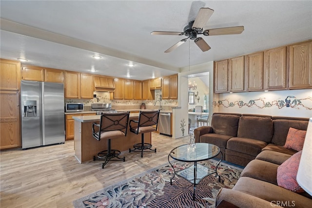 11361 Foxglove Ln, Corona, CA 92878 - living area with light wood-style floors, ceiling fan, and recessed lighting