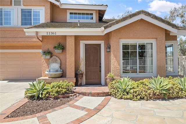 11361 Foxglove Ln, Corona, CA 92878 - entrance to property with stucco siding, a garage, and concrete driveway