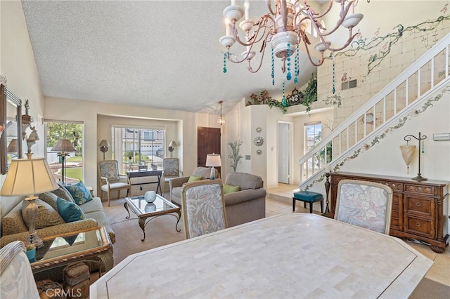 11361 Foxglove Ln, Corona, CA 92878 - tiled dining room featuring a chandelier, stairs, a textured ceiling, and high vaulted ceiling