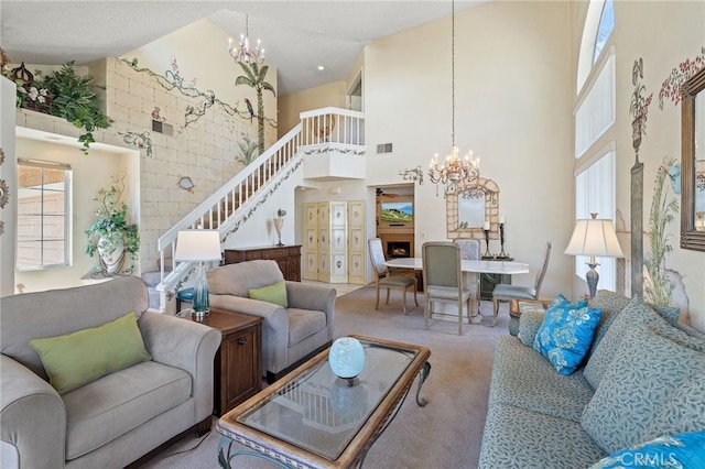 11361 Foxglove Ln, Corona, CA 92878 - living area with a towering ceiling, a chandelier, stairs, carpet floors, and a fireplace