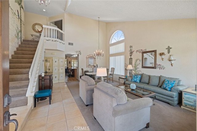 11361 Foxglove Ln, Corona, CA 92878 - living room featuring a chandelier, stairs, light tile patterned floors, and high vaulted ceiling