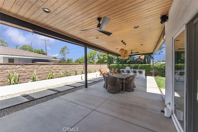 927 E Fairway Dr, Orange, CA 92866 - fenced backyard with a patio area, outdoor dining area, and a ceiling fan