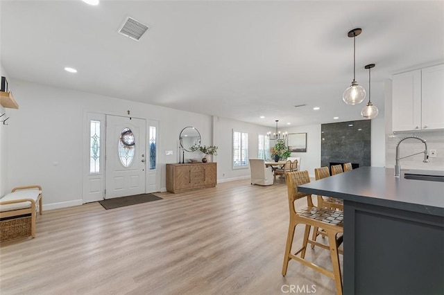 927 E Fairway Dr, Orange, CA 92866 - foyer entrance with light wood-type flooring, recessed lighting, and a chandelier