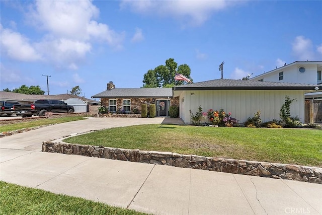 927 E Fairway Dr, Orange, CA 92866 - view of front of property featuring concrete driveway, a chimney, a front lawn, and stone siding