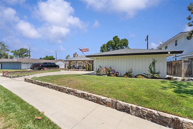 927 E Fairway Dr, Orange, CA 92866 - view of front of house featuring driveway and board and batten siding
