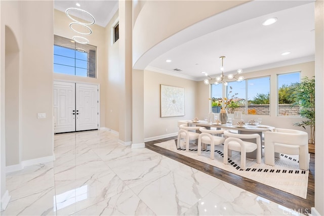 16389 Viewcrest Rd, Chino Hills, CA 91709 - entrance foyer with ornamental molding, a chandelier, arched walkways, recessed lighting, and marble finish flooring