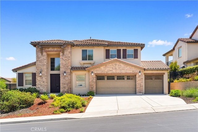 16389 Viewcrest Rd, Chino Hills, CA 91709 - mediterranean / spanish house with a tile roof, concrete driveway, an attached garage, and stucco siding