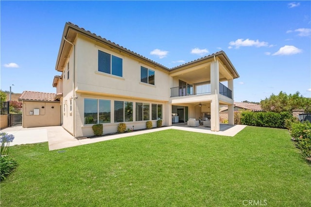 16389 Viewcrest Rd, Chino Hills, CA 91709 - rear view of house featuring a balcony, a patio area, stucco siding, a ceiling fan, and a tiled roof