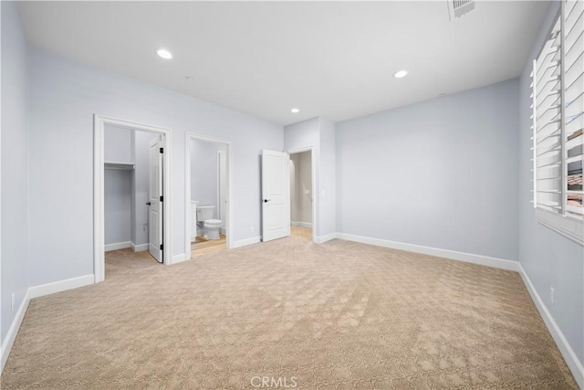 16389 Viewcrest Rd, Chino Hills, CA 91709 - unfurnished bedroom with light carpet, recessed lighting, a walk in closet, and connected bathroom