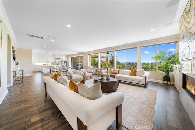 16389 Viewcrest Rd, Chino Hills, CA 91709 - living area featuring ornamental molding, dark wood-style flooring, a glass covered fireplace, and recessed lighting