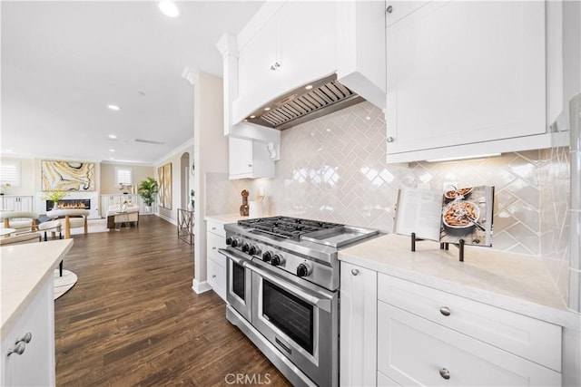 16389 Viewcrest Rd, Chino Hills, CA 91709 - kitchen with double oven range, white cabinets, dark wood-style floors, backsplash, and recessed lighting