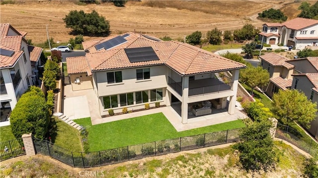 16389 Viewcrest Rd, Chino Hills, CA 91709 - back of house featuring a balcony, a fenced backyard, a patio, and roof mounted solar panels
