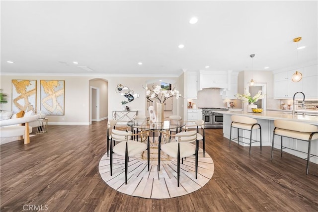 16389 Viewcrest Rd, Chino Hills, CA 91709 - dining room with recessed lighting, arched walkways, dark wood-style flooring, and crown molding