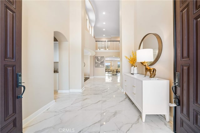 16389 Viewcrest Rd, Chino Hills, CA 91709 - foyer with arched walkways, light marble finish floors, a towering ceiling, and recessed lighting