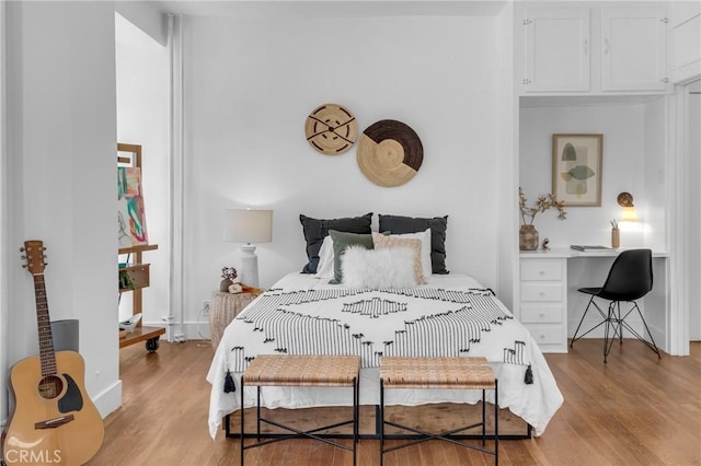 360 W Ocean Blvd Unit 402, Long Beach, CA 90802 - bedroom with light wood-type flooring and an office area