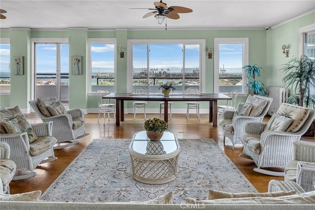 360 W Ocean Blvd Unit 402, Long Beach, CA 90802 - living room featuring ceiling fan, ornamental molding, and dark wood-type flooring