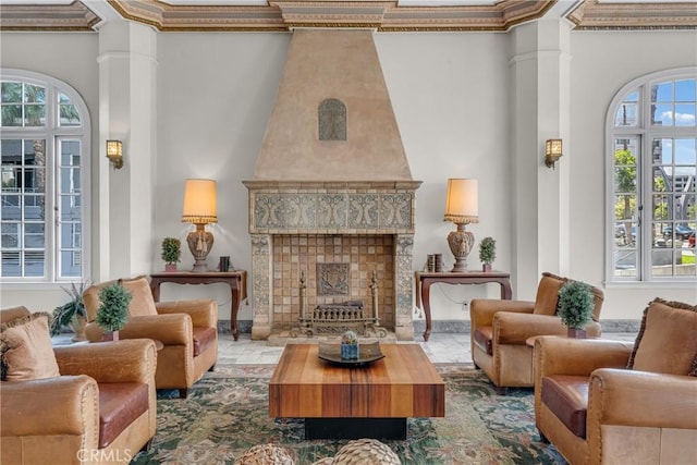 360 W Ocean Blvd Unit 402, Long Beach, CA 90802 - living area featuring a high ceiling, plenty of natural light, ornate columns, and a fireplace
