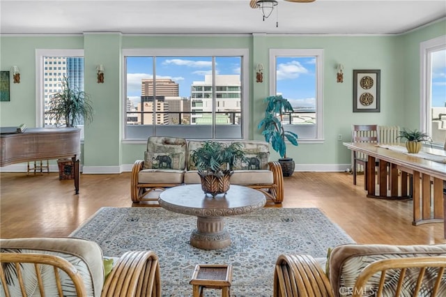 360 W Ocean Blvd Unit 402, Long Beach, CA 90802 - living room featuring wood finished floors, ornamental molding, and ceiling fan