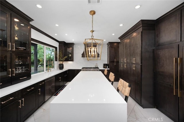 5231 Flora Ct, Rancho Cucamonga, CA 91739 - kitchen with dishwasher, light marble finish flooring, recessed lighting, glass insert cabinets, and light countertops