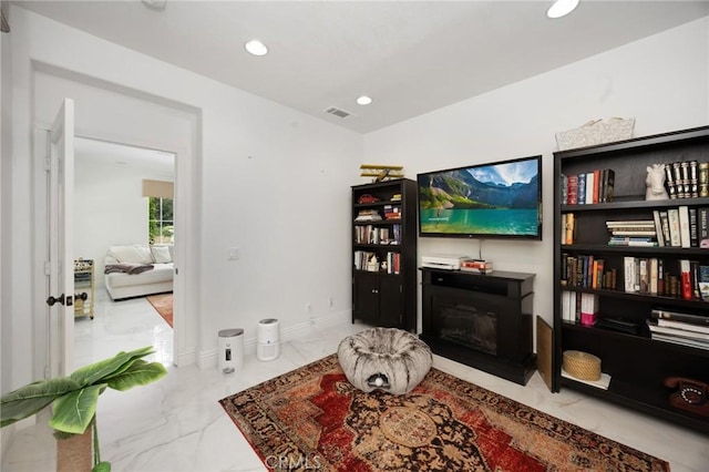 5231 Flora Ct, Rancho Cucamonga, CA 91739 - living room featuring marble finish floors, recessed lighting, and a glass covered fireplace