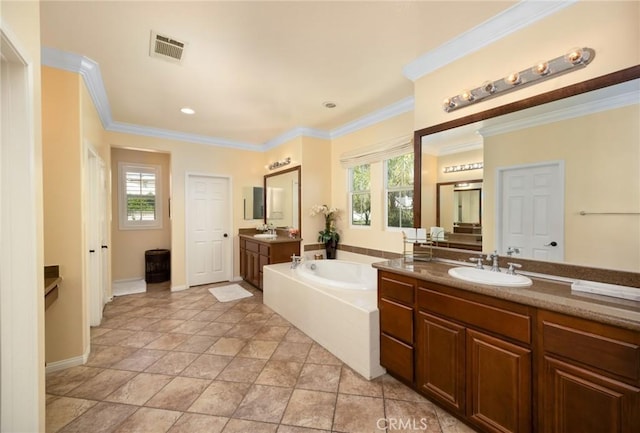 5231 Flora Ct, Rancho Cucamonga, CA 91739 - full bathroom featuring a garden tub, two vanities, ornamental molding, recessed lighting, and stone finish floors