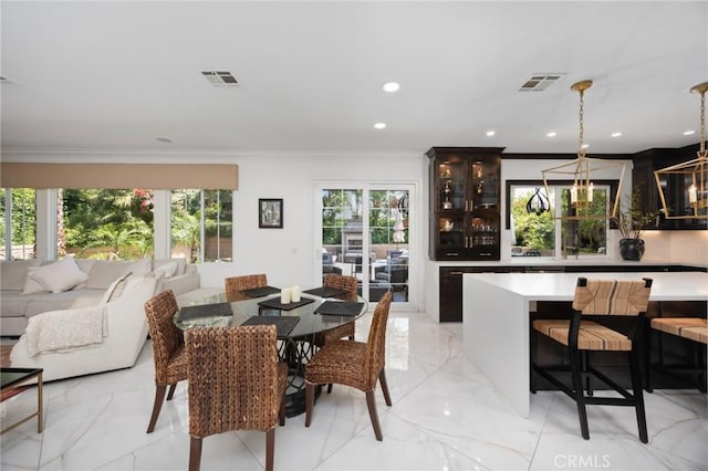 5231 Flora Ct, Rancho Cucamonga, CA 91739 - dining area with ornamental molding, light marble finish flooring, and recessed lighting