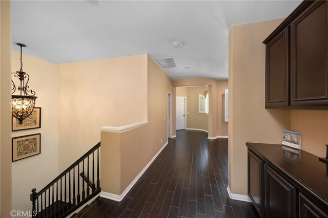 5231 Flora Ct, Rancho Cucamonga, CA 91739 - hall featuring an upstairs landing, a chandelier, and dark wood-style floors