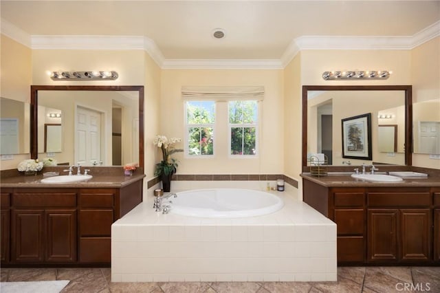 5231 Flora Ct, Rancho Cucamonga, CA 91739 - bathroom featuring a garden tub, two vanities, crown molding, and tile patterned floors