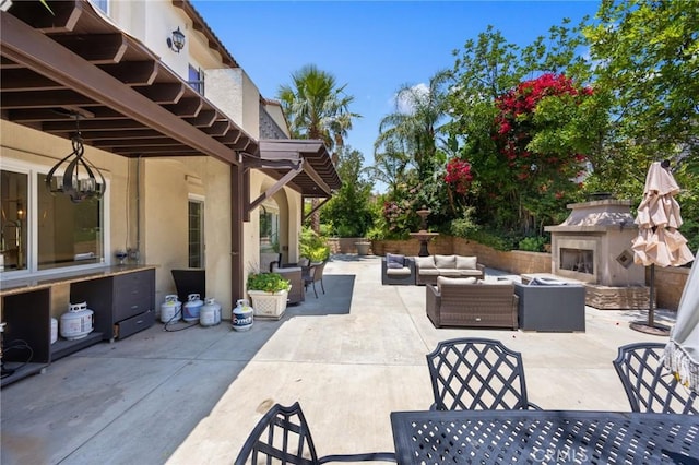 5231 Flora Ct, Rancho Cucamonga, CA 91739 - view of patio with an outdoor living space with a fireplace and outdoor dining area