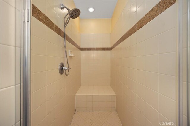 5231 Flora Ct, Rancho Cucamonga, CA 91739 - bathroom featuring a shower stall, tile walls, and recessed lighting