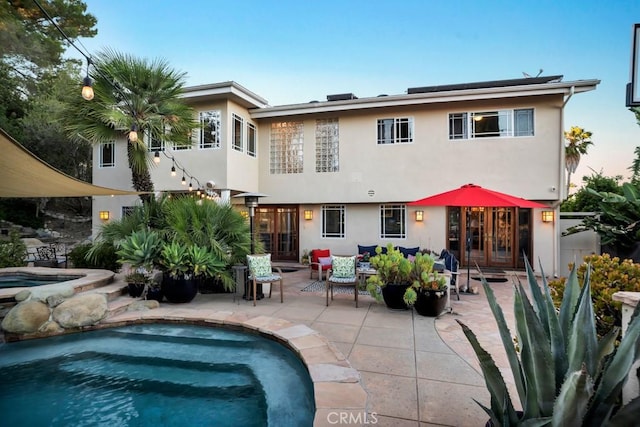 24630 Kittridge St, West Hills, CA 91307 - back of house featuring a patio area, french doors, and stucco siding