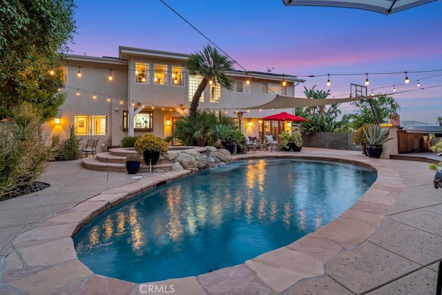 24630 Kittridge St, West Hills, CA 91307 - pool at dusk with a patio area, an outdoor pool, and a hot tub
