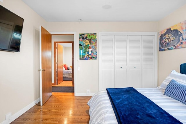 24630 Kittridge St, West Hills, CA 91307 - bedroom with light wood-type flooring and a closet