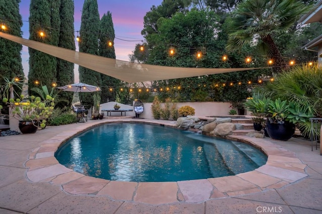 24630 Kittridge St, West Hills, CA 91307 - pool at dusk with a patio area and a fenced backyard