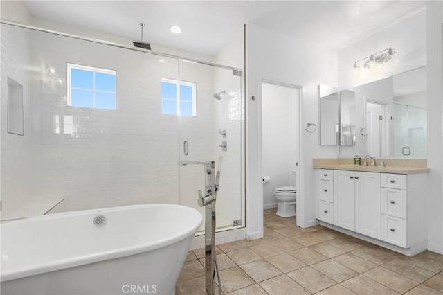 403 Aura Dr, Costa Mesa, CA 92626 - bathroom featuring a shower stall, a soaking tub, and vanity