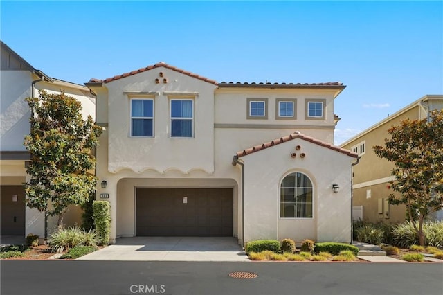 403 Aura Dr, Costa Mesa, CA 92626 - mediterranean / spanish home featuring stucco siding, a tile roof, concrete driveway, and a garage