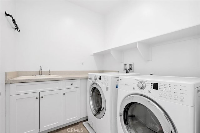 403 Aura Dr, Costa Mesa, CA 92626 - washroom with washer and clothes dryer and cabinet space