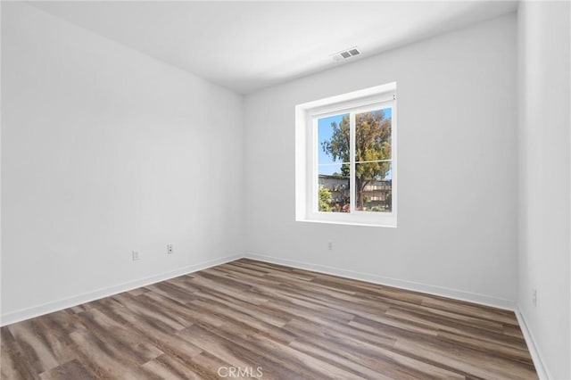 403 Aura Dr, Costa Mesa, CA 92626 - unfurnished room with wood finished floors and baseboards