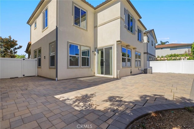 403 Aura Dr, Costa Mesa, CA 92626 - rear view of house featuring a patio and stucco siding