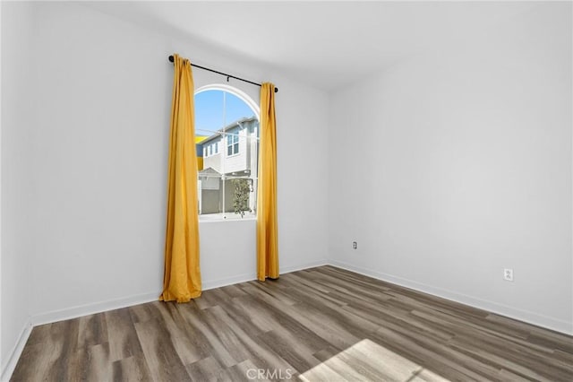 403 Aura Dr, Costa Mesa, CA 92626 - spare room with wood finished floors and baseboards