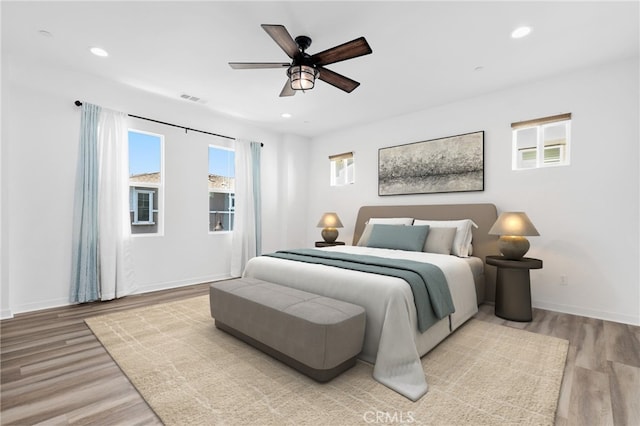 403 Aura Dr, Costa Mesa, CA 92626 - bedroom featuring wood finished floors, recessed lighting, and a ceiling fan