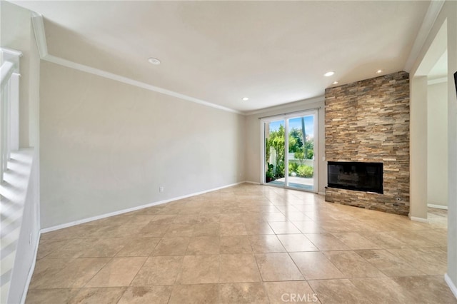 5 Chandon, Laguna Niguel, CA 92677 - unfurnished living room with ornamental molding, a stone fireplace, recessed lighting, and light tile patterned floors
