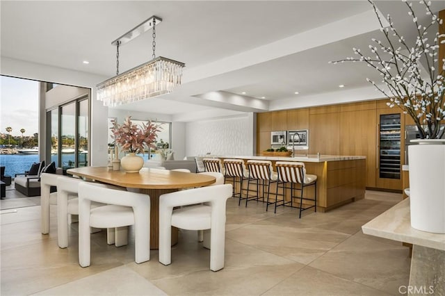 323 Morning Star Ln, Newport Beach, CA 92660 - dining room featuring wine cooler, recessed lighting, light tile patterned floors, and a chandelier