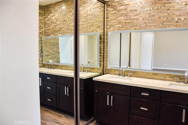 6584 E Paseo Diego, Anaheim, CA 92807 - full bath featuring double vanity, backsplash, and wood finished floors