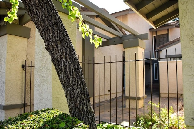6584 E Paseo Diego, Anaheim, CA 92807 - view of side of home with stucco siding and a gate