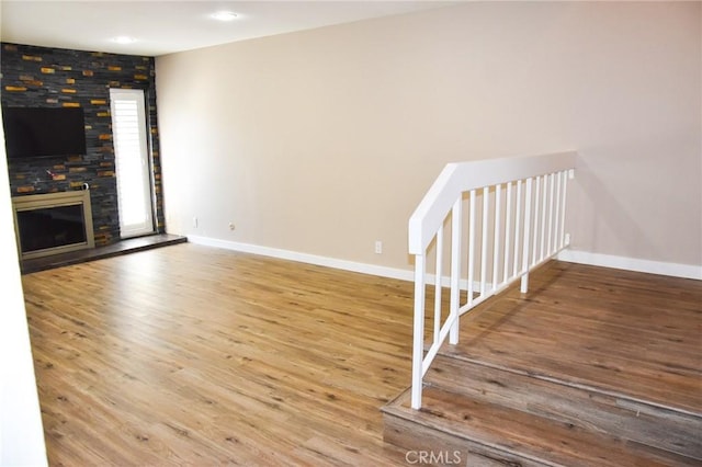 6584 E Paseo Diego, Anaheim, CA 92807 - unfurnished living room with wood finished floors, a fireplace, and recessed lighting